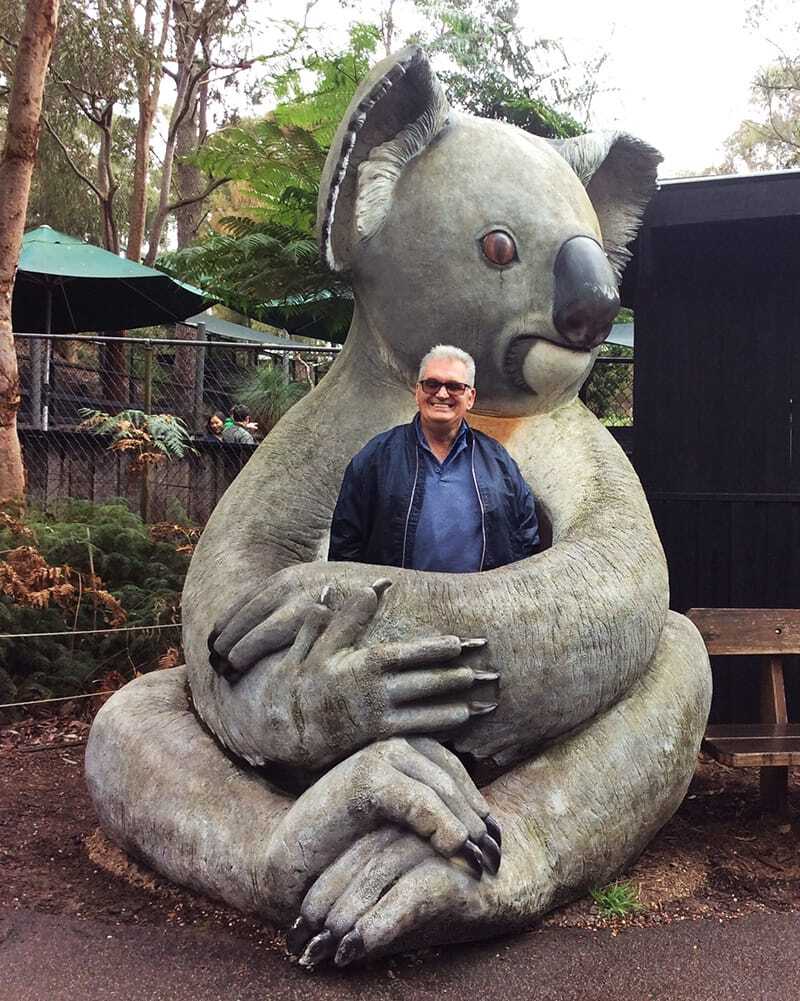 Headway adp participant with koala statue on social outing